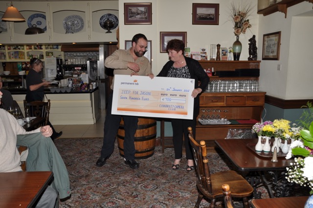 Kathleen Hayes, chair of Clonakilty Camera Club presents Dr. Jason van der Velde with a fundraising cheque for the West Cork Rapid Response Unit's 'Jeep For Jason' appeal.