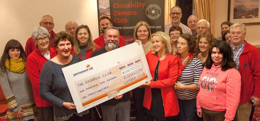 Members of Clonakilty Camera Club present a cheque to the Rainbow Club